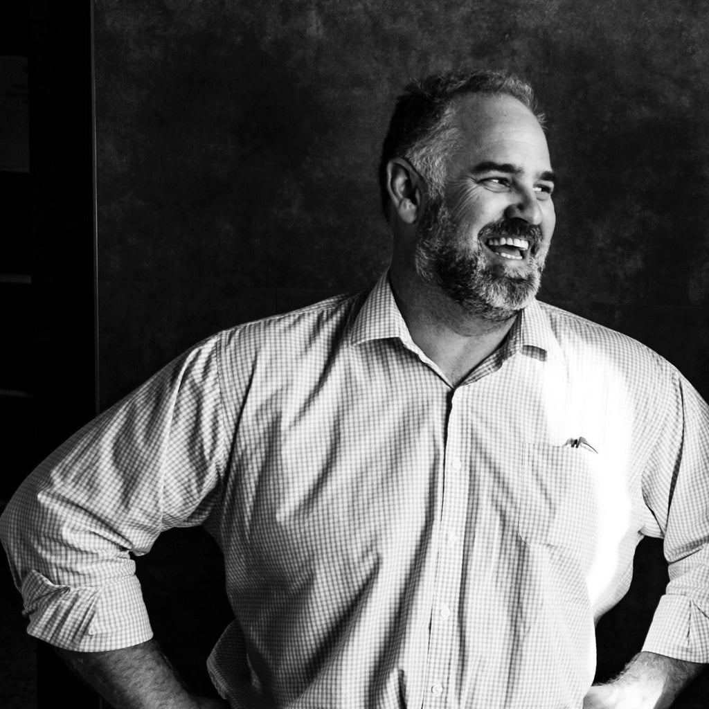 A black and white photo of Darren Haunold, who founded Wills Domain in 2000, now a Halliday 5 Red Star-rated Margaret River winery and home to one of Western Australia’s most-awarded regional restaurants.