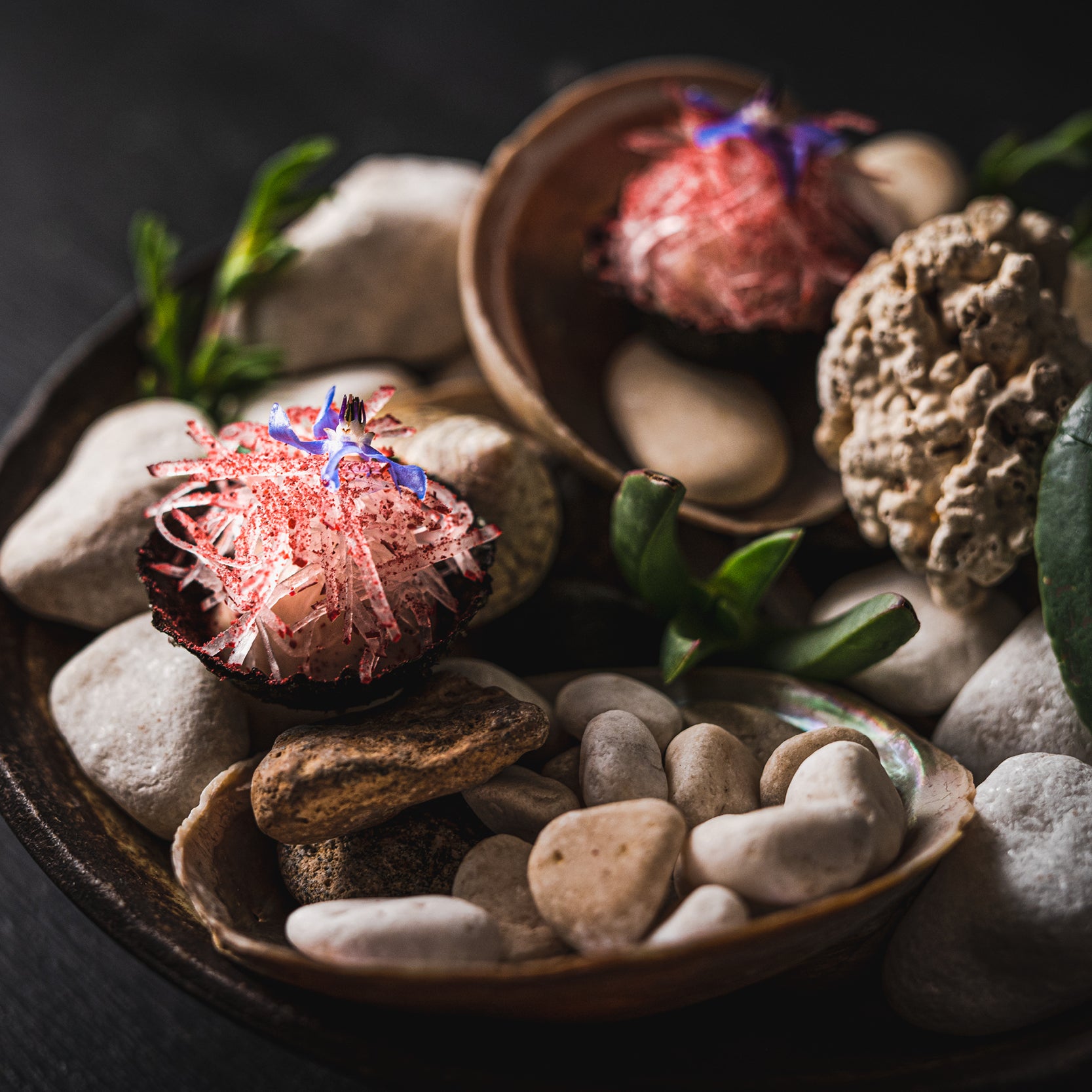 A close up shot of a tasting course served on a bed of pebbles from the degustation menu at Wills Domain in Margaret River.