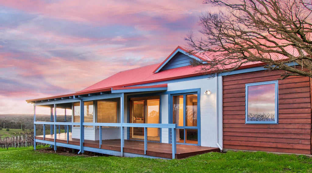 The Wills Domain homestead at sunset is a modern farm stay accommodation in the Margaret River wine region that can sleep up to 10.